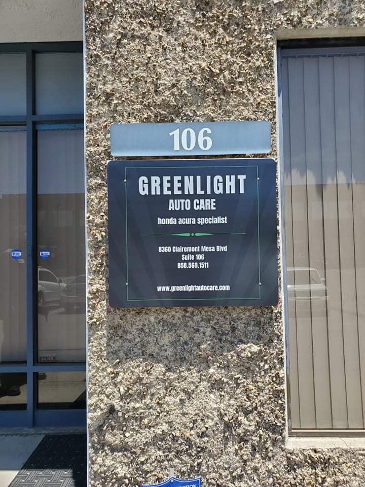 Suite 106 storefront plaque at Greenlight Auto Care